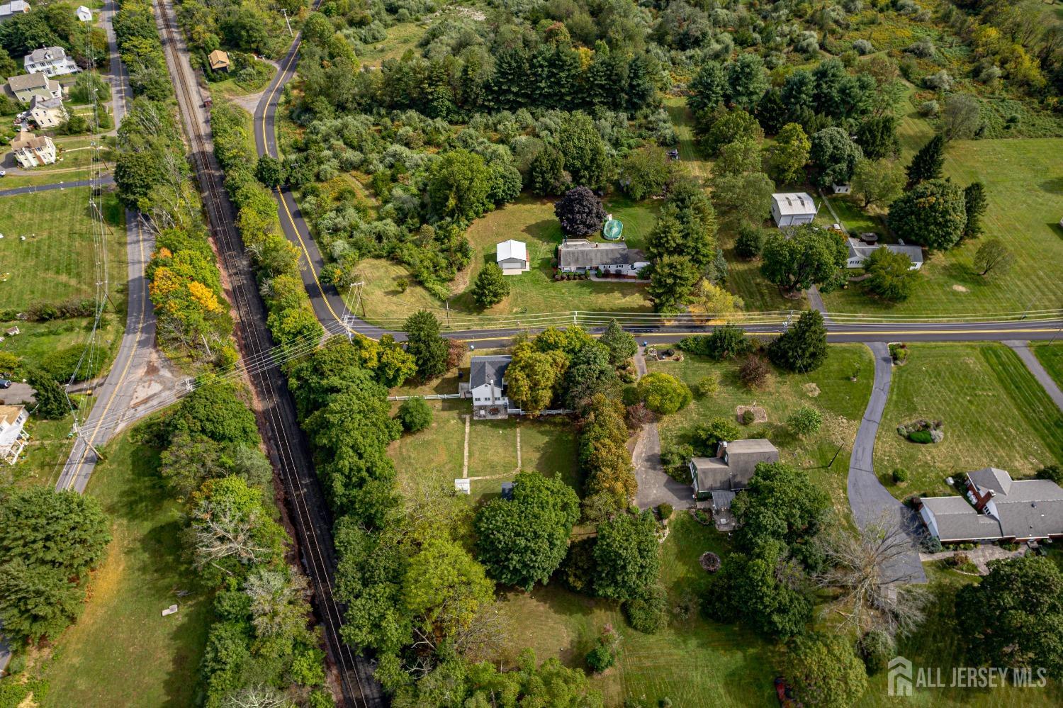 300 Blackpoint Road Neshanic Station, NJ 08853 - Photo 3 of 34 an aerial view of residential houses with outdoor space and trees