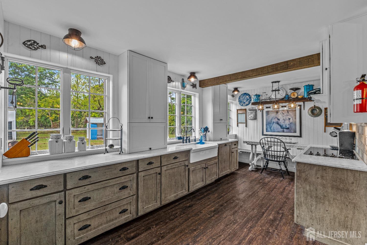 300 Blackpoint Road Neshanic Station, NJ 08853 - Photo 32 of 34 a kitchen with lots of counter top space and wooden floor
