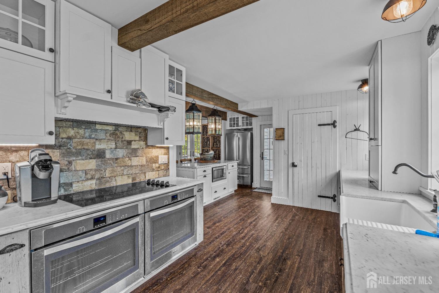 300 Blackpoint Road Neshanic Station, NJ 08853 - Photo 33 of 34 a kitchen with stainless steel appliances granite countertop a stove and cabinets