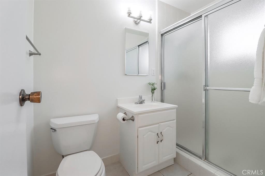 1870 Burch Avenue Simi Valley, CA 93063 - Photo 14 of 22 a bathroom with a toilet sink and mirror