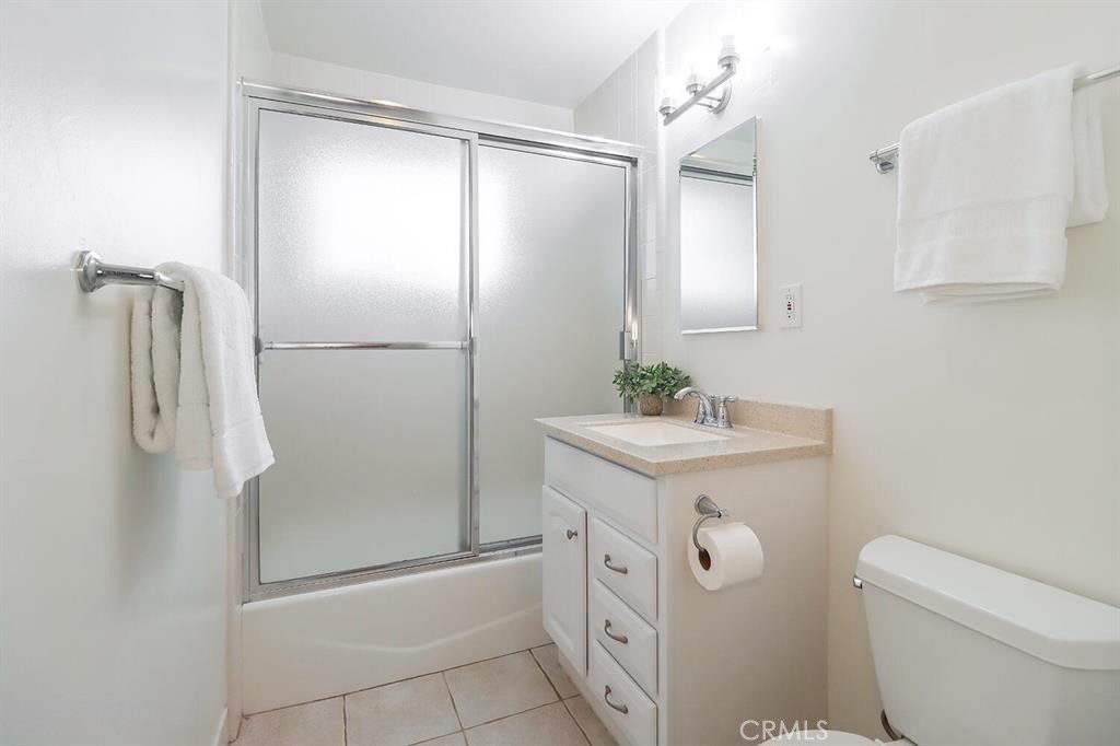 1870 Burch Avenue Simi Valley, CA 93063 - Photo 15 of 20 a bathroom with a shower a sink and a mirror