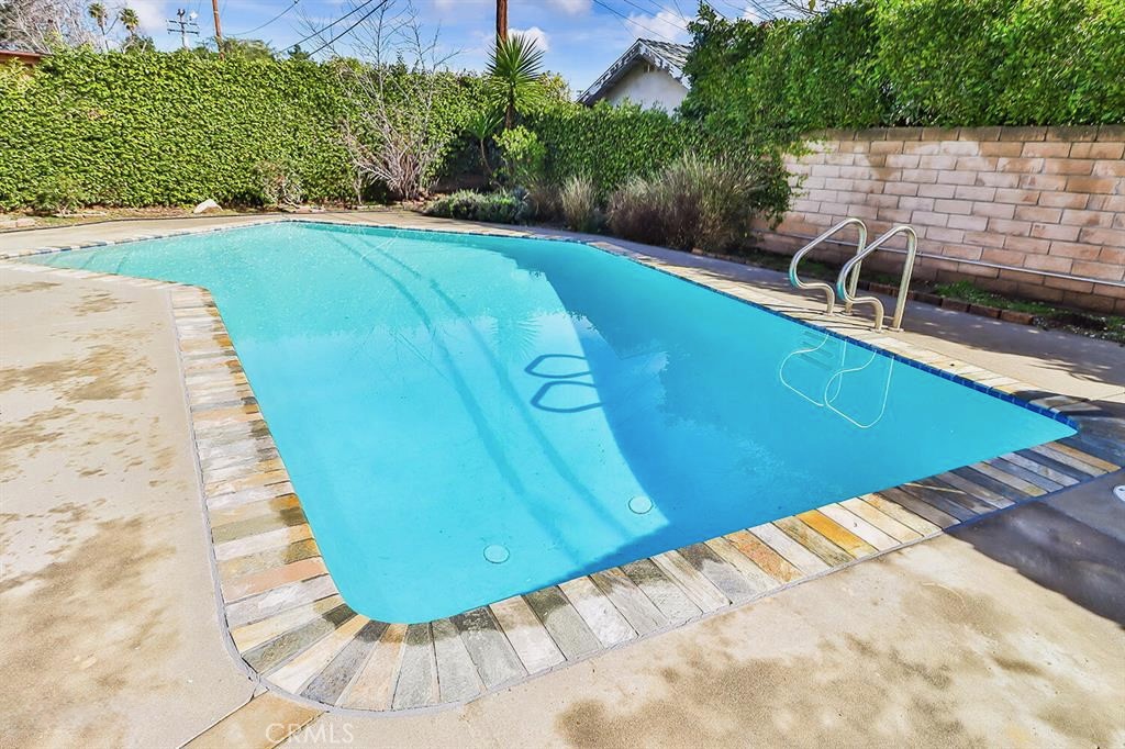1870 Burch Avenue Simi Valley, CA 93063 - Photo 17 of 20 a view of a swimming pool with a yard