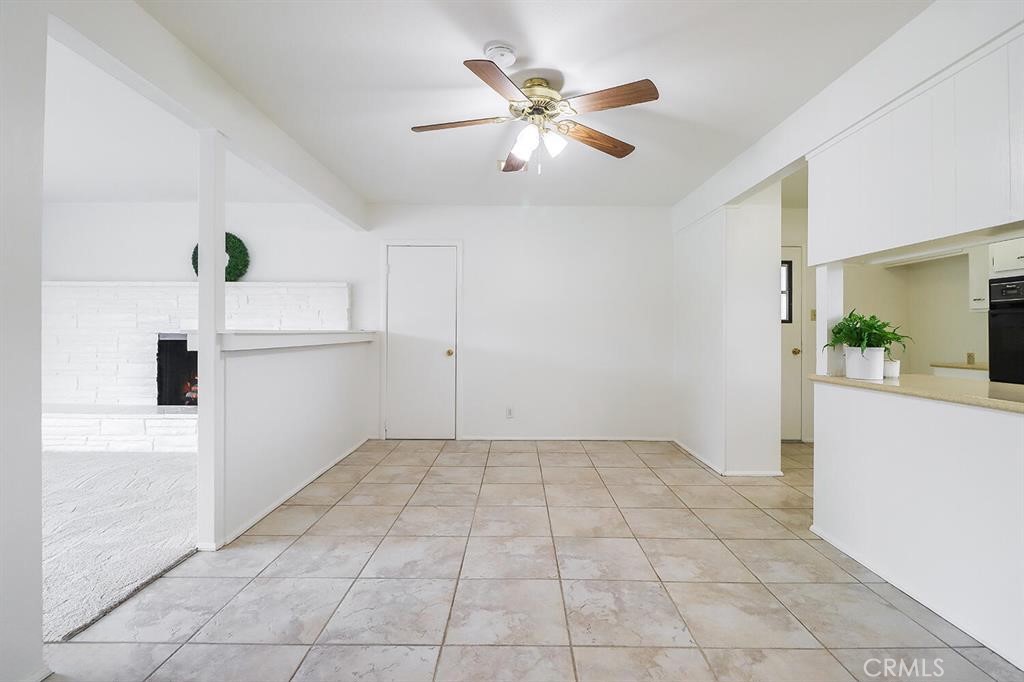 1870 Burch Avenue Simi Valley, CA 93063 - Photo 8 of 22 a view of a livingroom with wooden floor and a ceiling fan