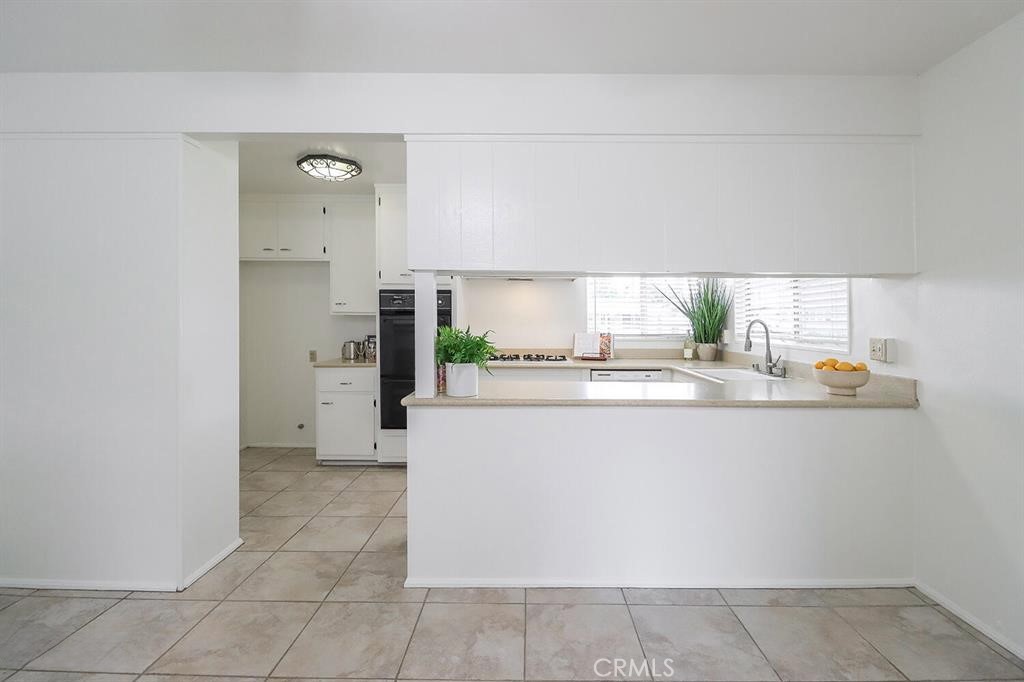 1870 Burch Avenue Simi Valley, CA 93063 - Photo 9 of 22 a kitchen with stainless steel appliances a refrigerator and a stove
