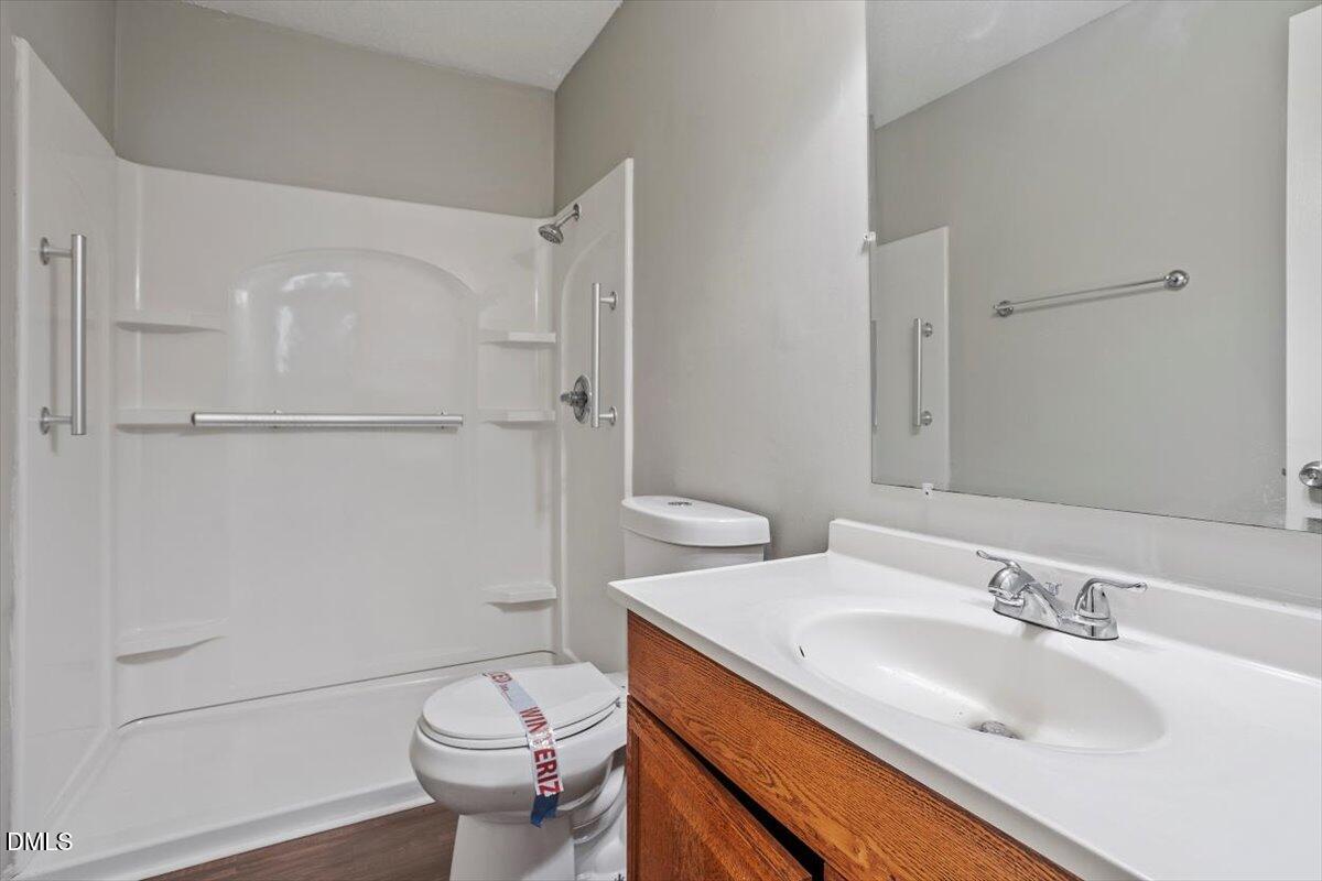 100 Brook Rock Lane Garner, NC 27529 - Photo 29 of 33 a bathroom with a sink toilet and shower