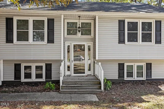 a front view of a house with stairs