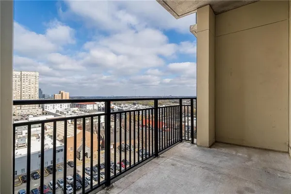 a view of a balcony with furniture