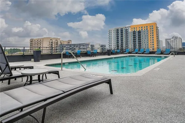 a view of a swimming pool with a patio