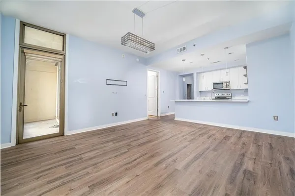 a view of a kitchen from the hallway