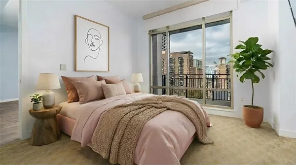 a bedroom with a bed and a potted plant