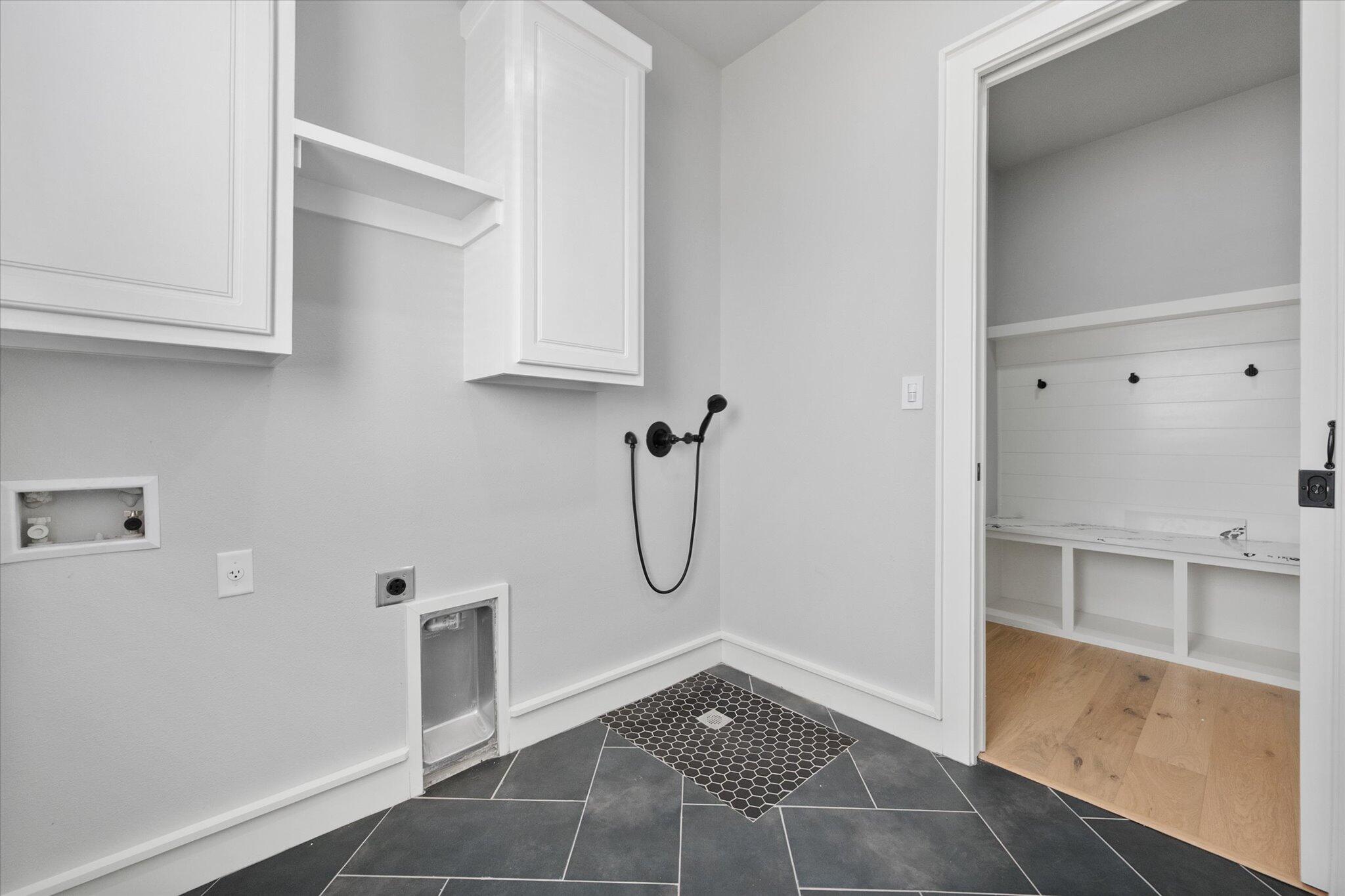 7516 57th Street Lubbock, TX 79407 - Photo 21 of 35 a bathroom with a glass shower door