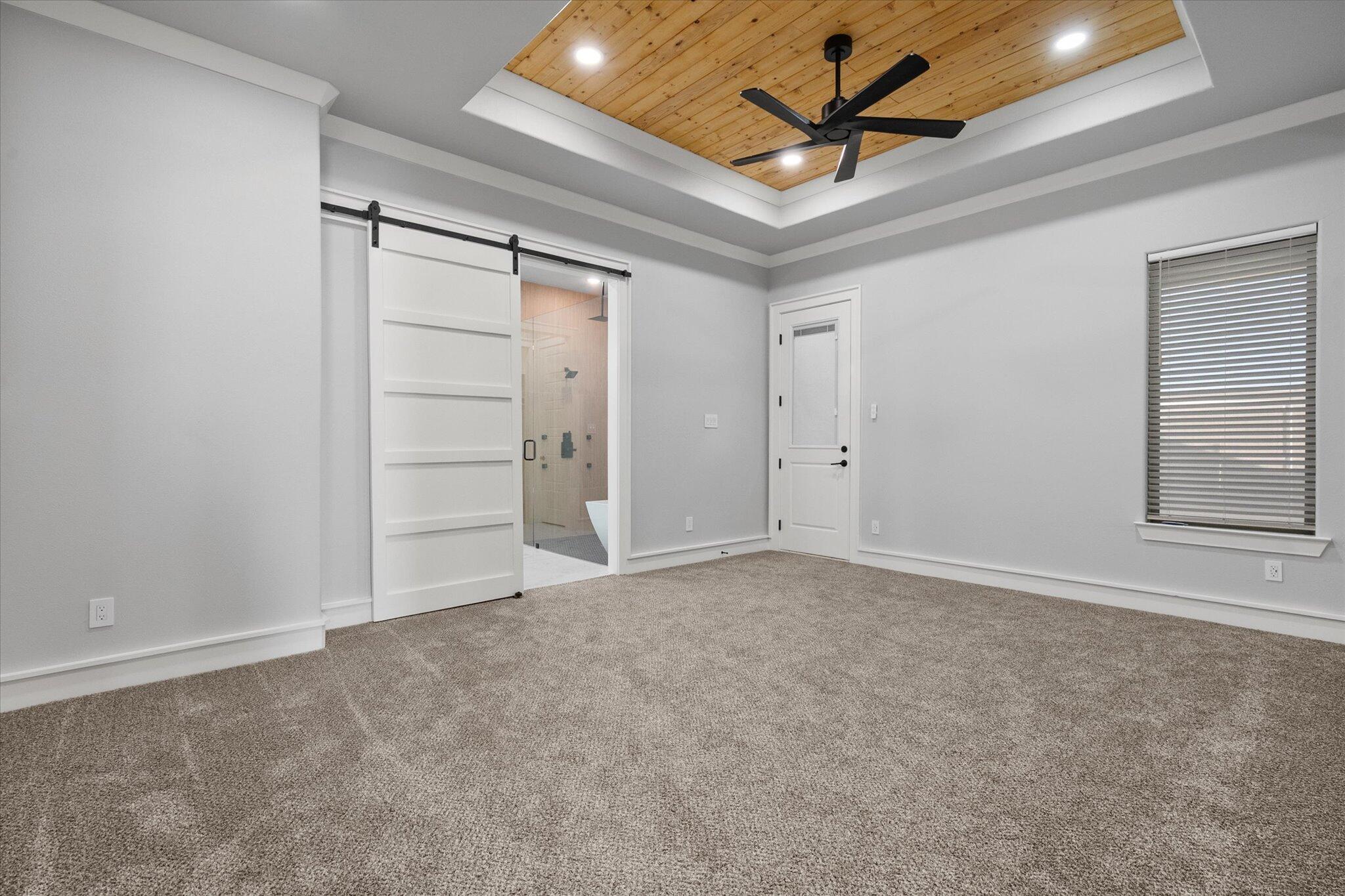 7516 57th Street Lubbock, TX 79407 - Photo 22 of 35 an empty room with closet and a ceiling fan