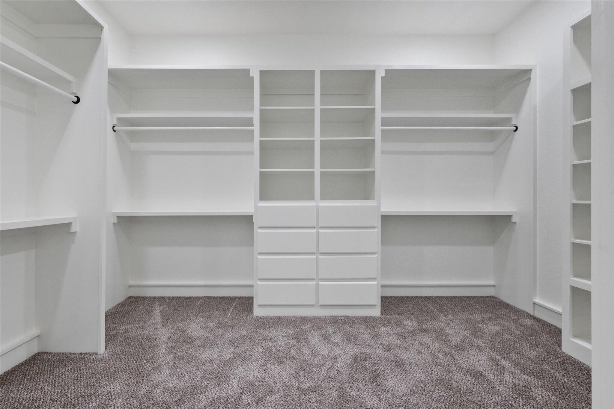 7516 57th Street Lubbock, TX 79407 - Photo 28 of 35 a view of an empty walk in closet