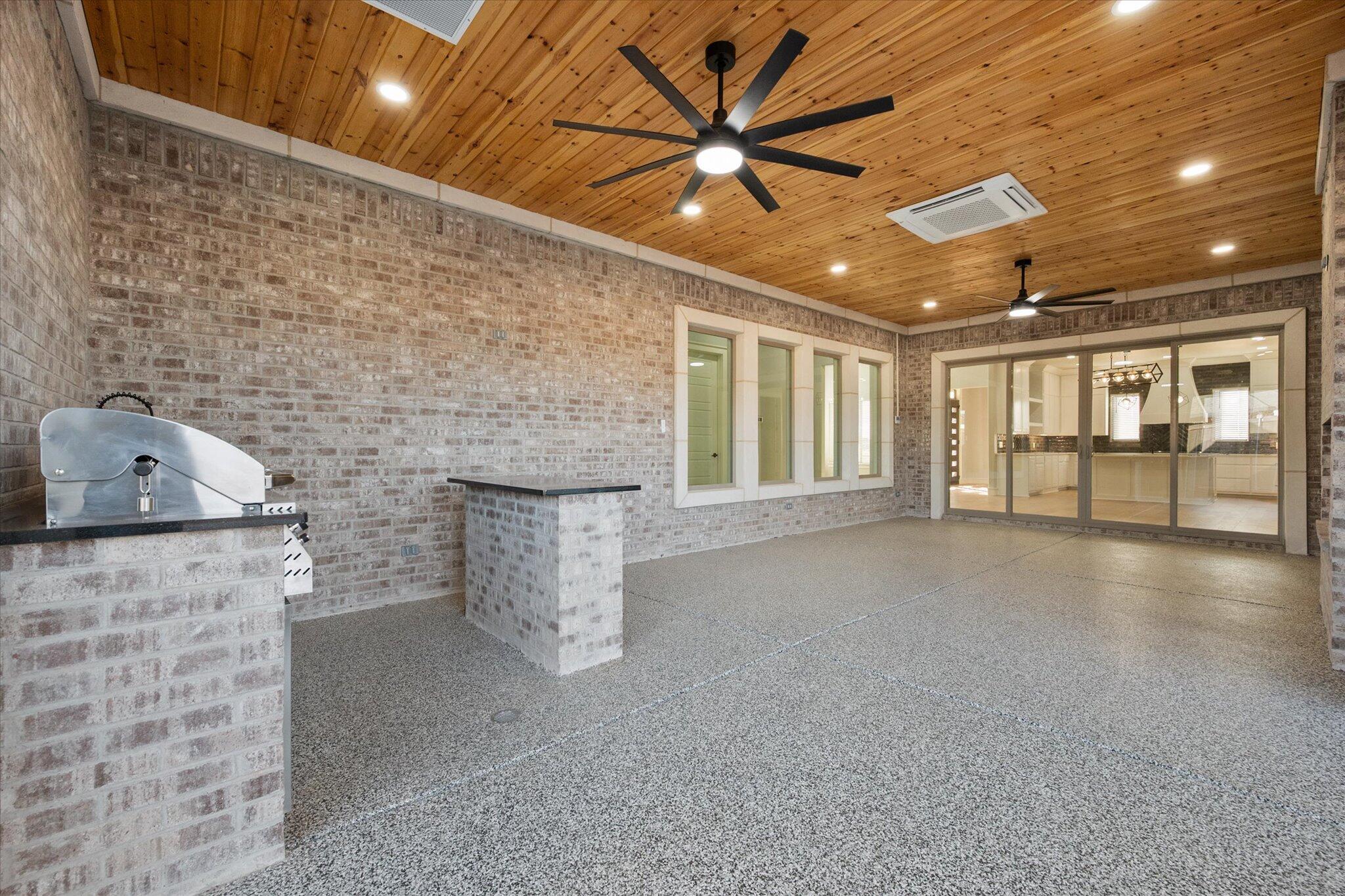 7516 57th Street Lubbock, TX 79407 - Photo 31 of 35 a view of an empty room with a fireplace and a window