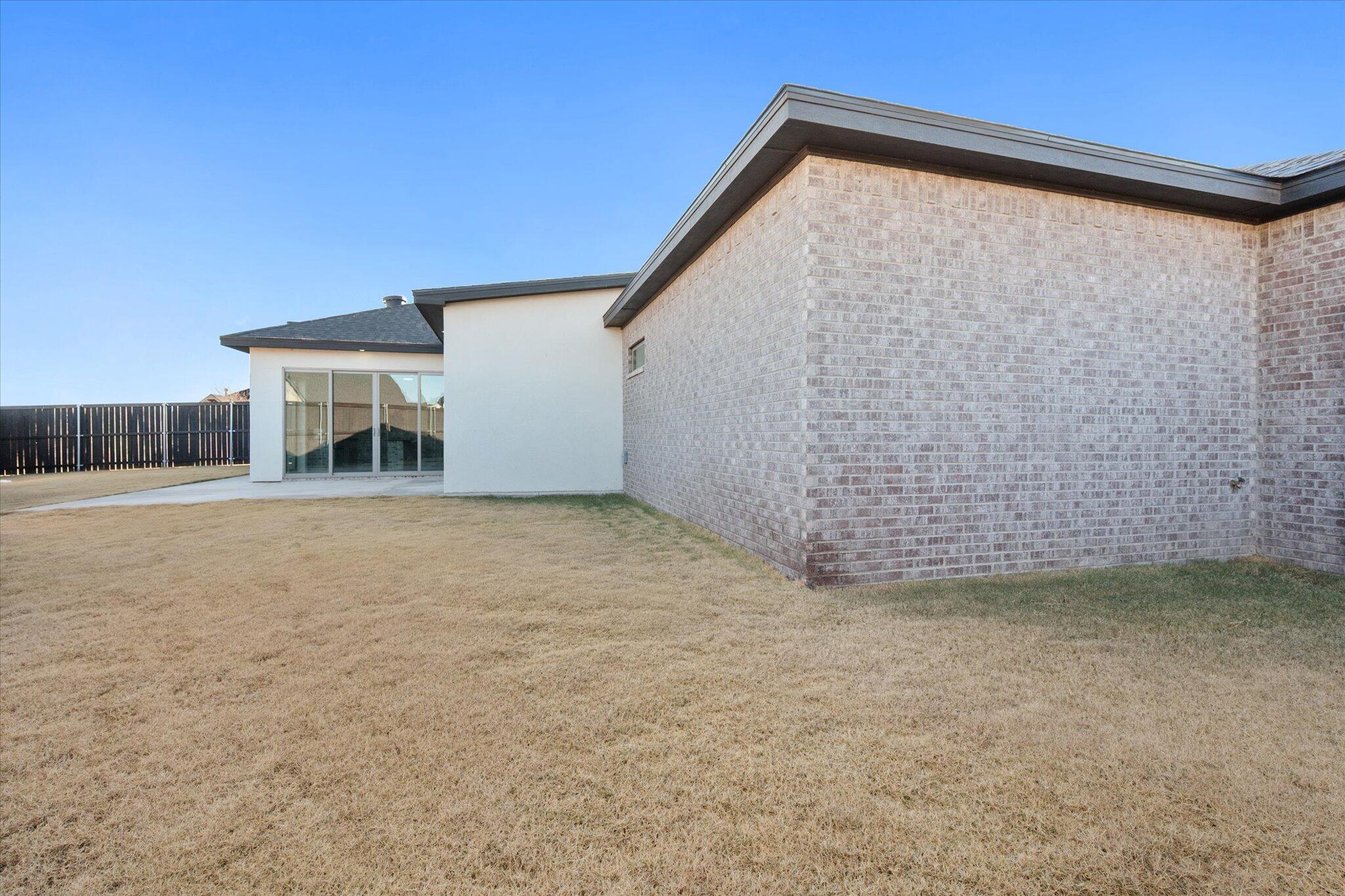 7516 57th Street Lubbock, TX 79407 - Photo 33 of 35 a view of a house with a yard