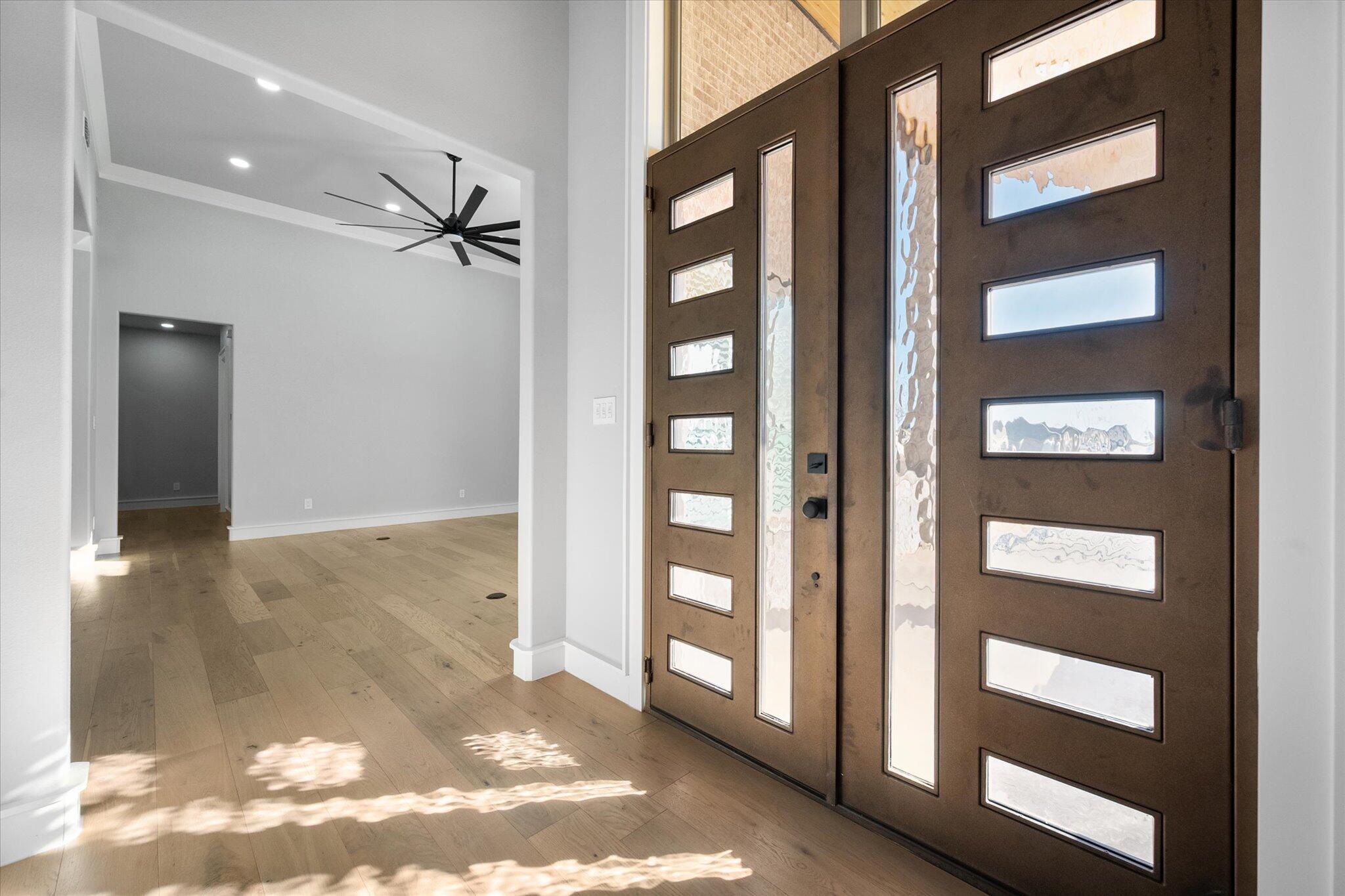 7516 57th Street Lubbock, TX 79407 - Photo 4 of 35 a view of a hallway with a door
