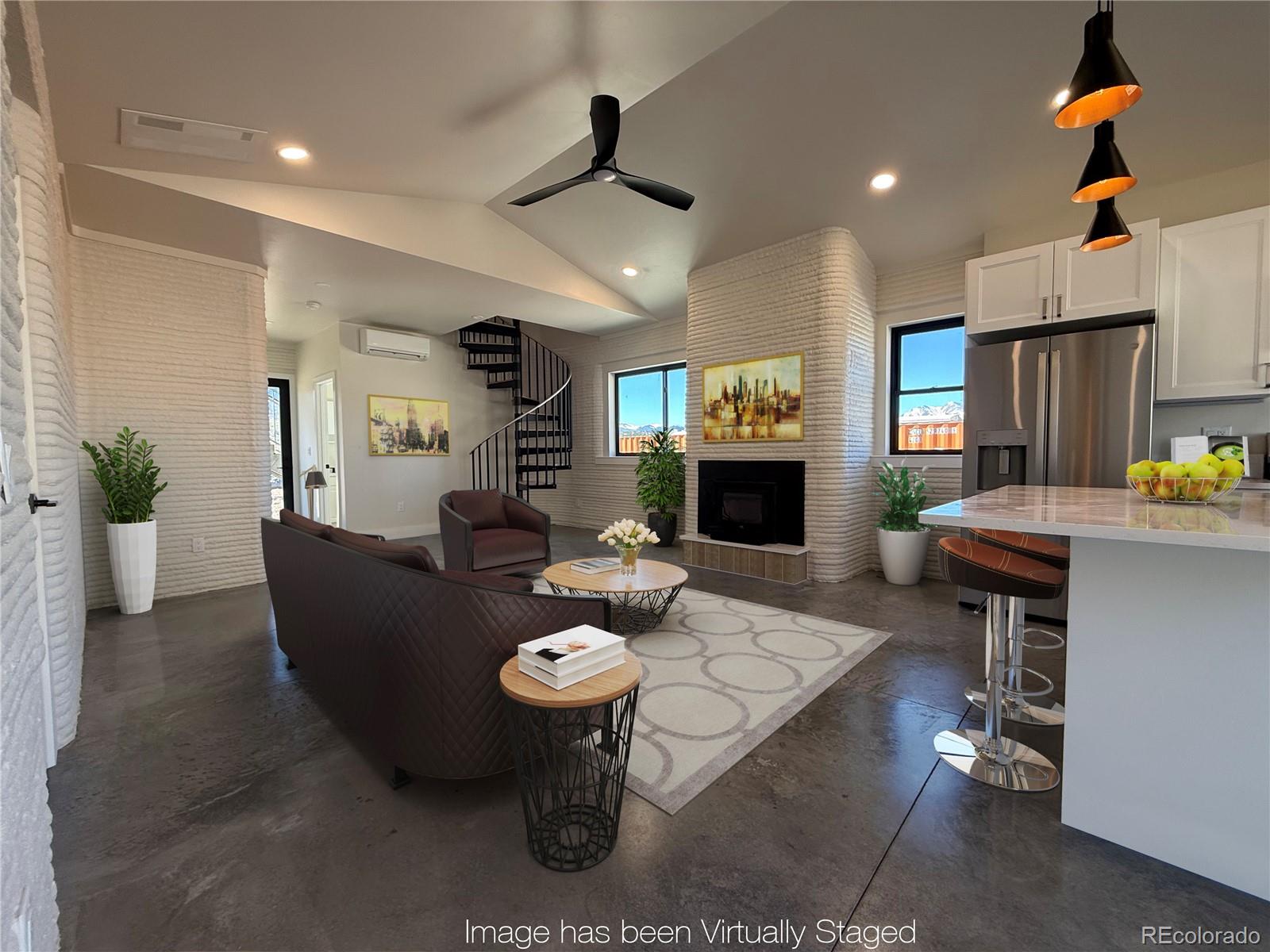 a living room with fireplace furniture and a wooden floor