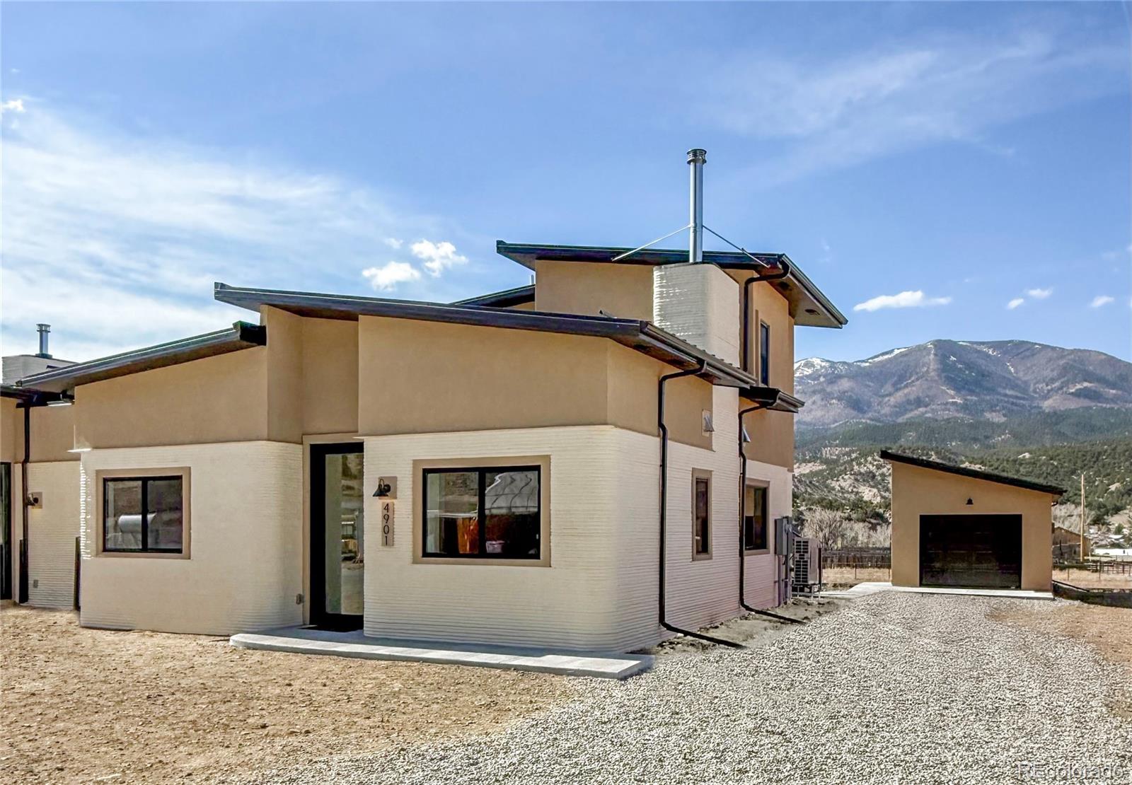 4901 Main Street Salida, CO 81201 - Photo 2 of 14 a front view of a house with a yard