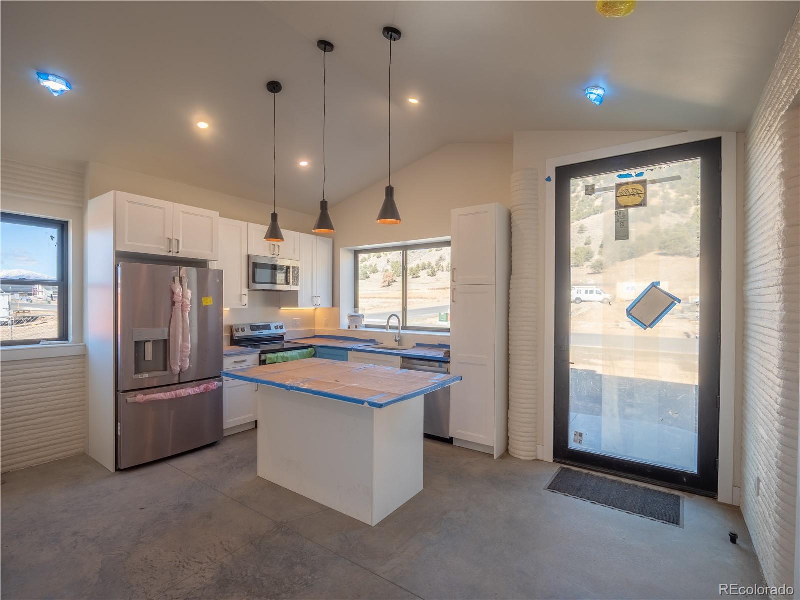 4901 Main Street Salida, CO 81201 - Photo 4 of 14 a kitchen with refrigerator and windows