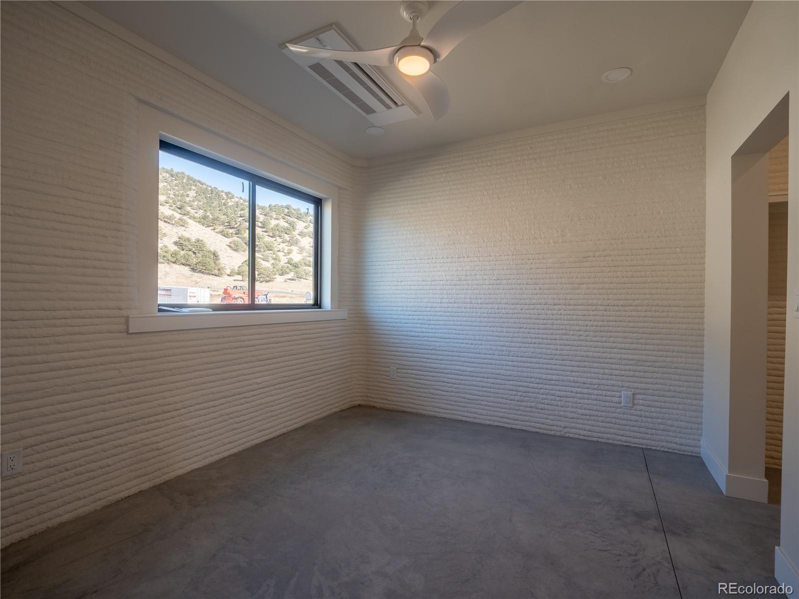 4901 Main Street Salida, CO 81201 - Photo 6 of 14 a view of an empty room with a window