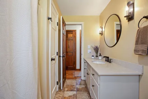 a bathroom with 2 sink and a mirror