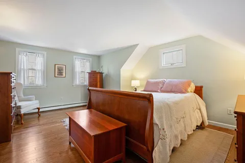 a bedroom with bed and window