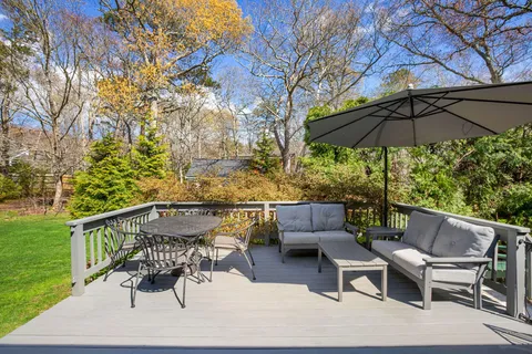 a patio with a patio table and chairs