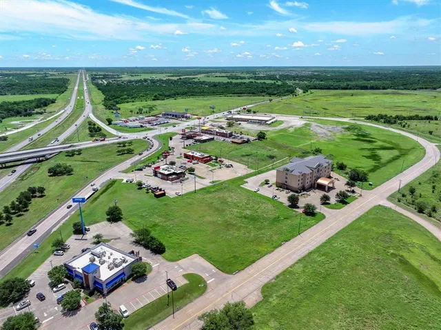 a view of a play house with a big yard