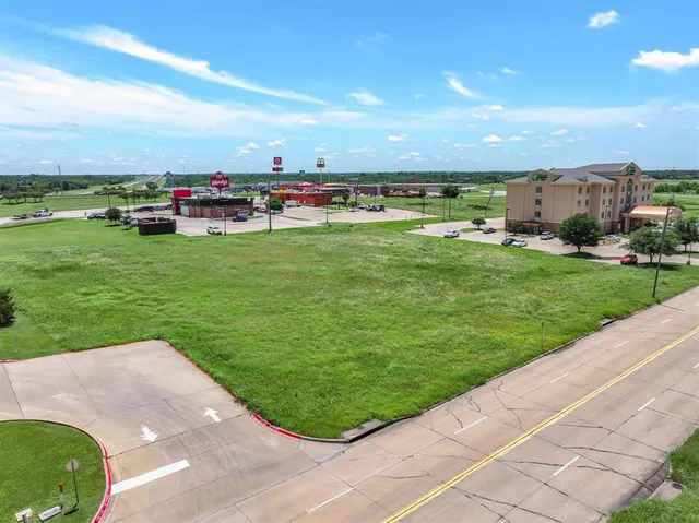 a view of a golf course with a lake