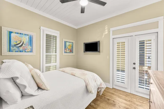 a bedroom with a bed and a painting on the wall