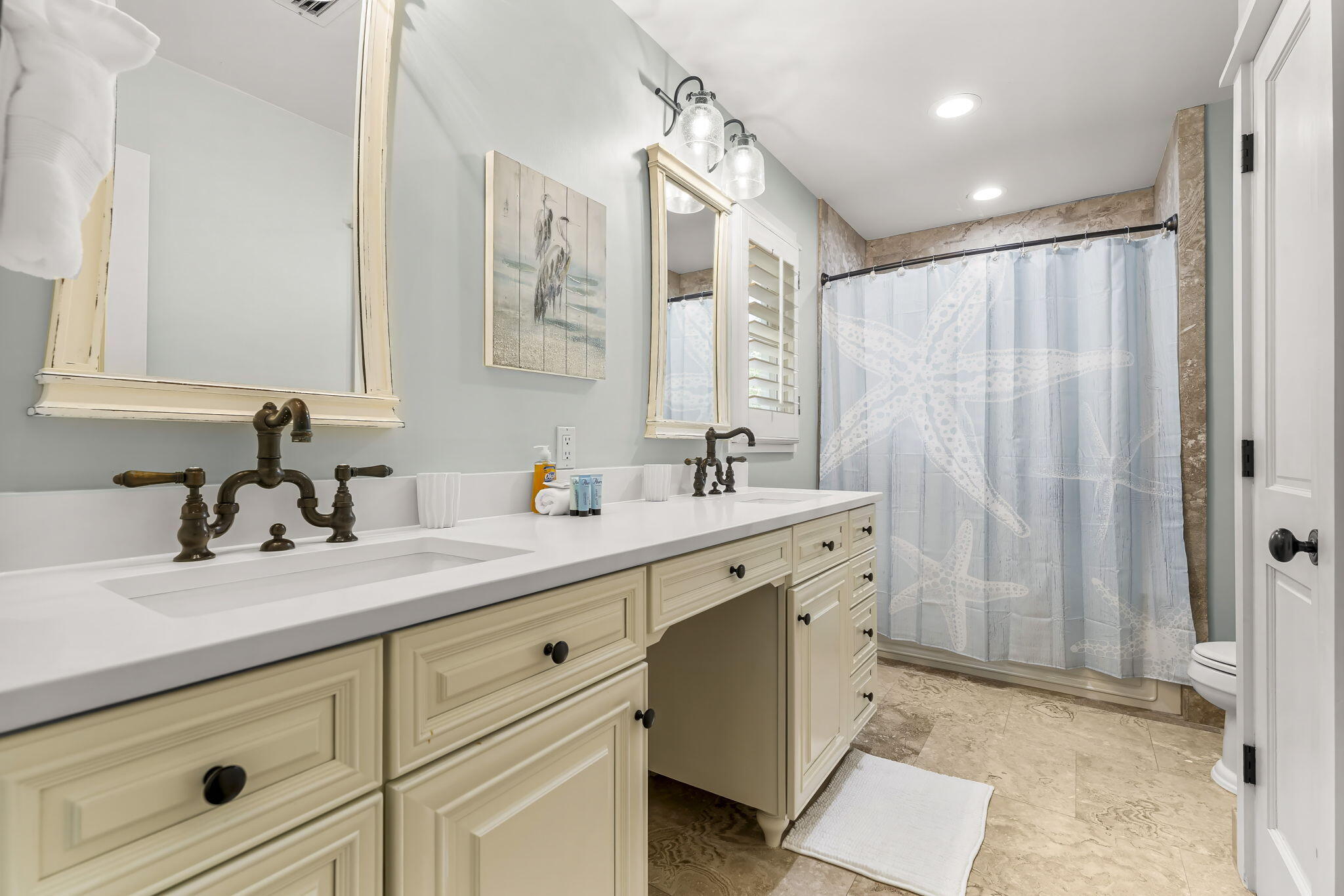 60 Rue Caribe Miramar Beach, FL 32550 - Photo 22 of 43 a bathroom with a double vanity sink mirror and shower