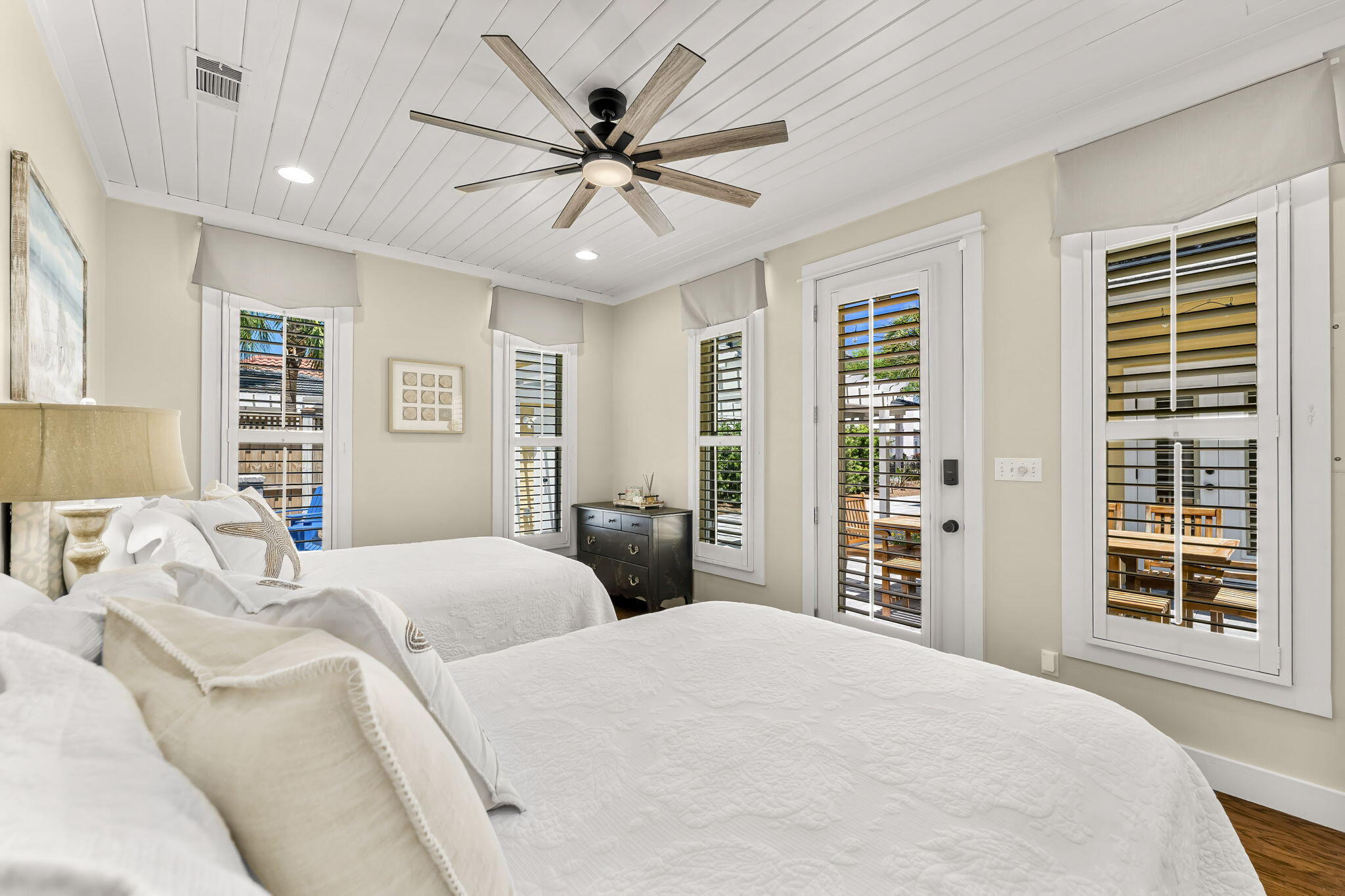 60 Rue Caribe Miramar Beach, FL 32550 - Photo 29 of 43 a bedroom with a large bed and a large window