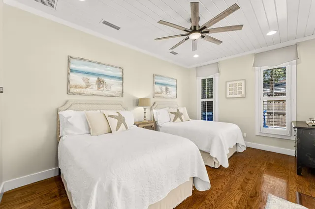 a bedroom with a large bed and a large window