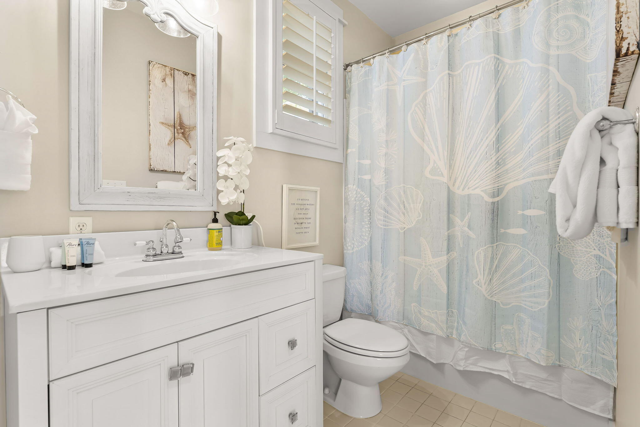 60 Rue Caribe Miramar Beach, FL 32550 - Photo 31 of 43 a bathroom with a sink a toilet and a mirror