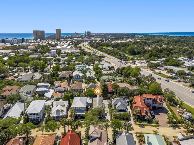 an aerial view of residential houses with city view