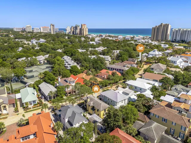 an aerial view of residential houses with city view