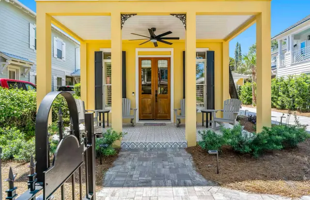 a view of a patio with a table and chairs