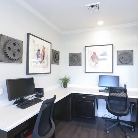 a workspace with furniture and wooden floor