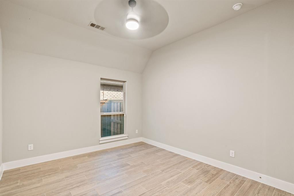 1314 Buttermere Street Forney, TX 75126 - Photo 16 of 32 an empty room with wooden floor and windows