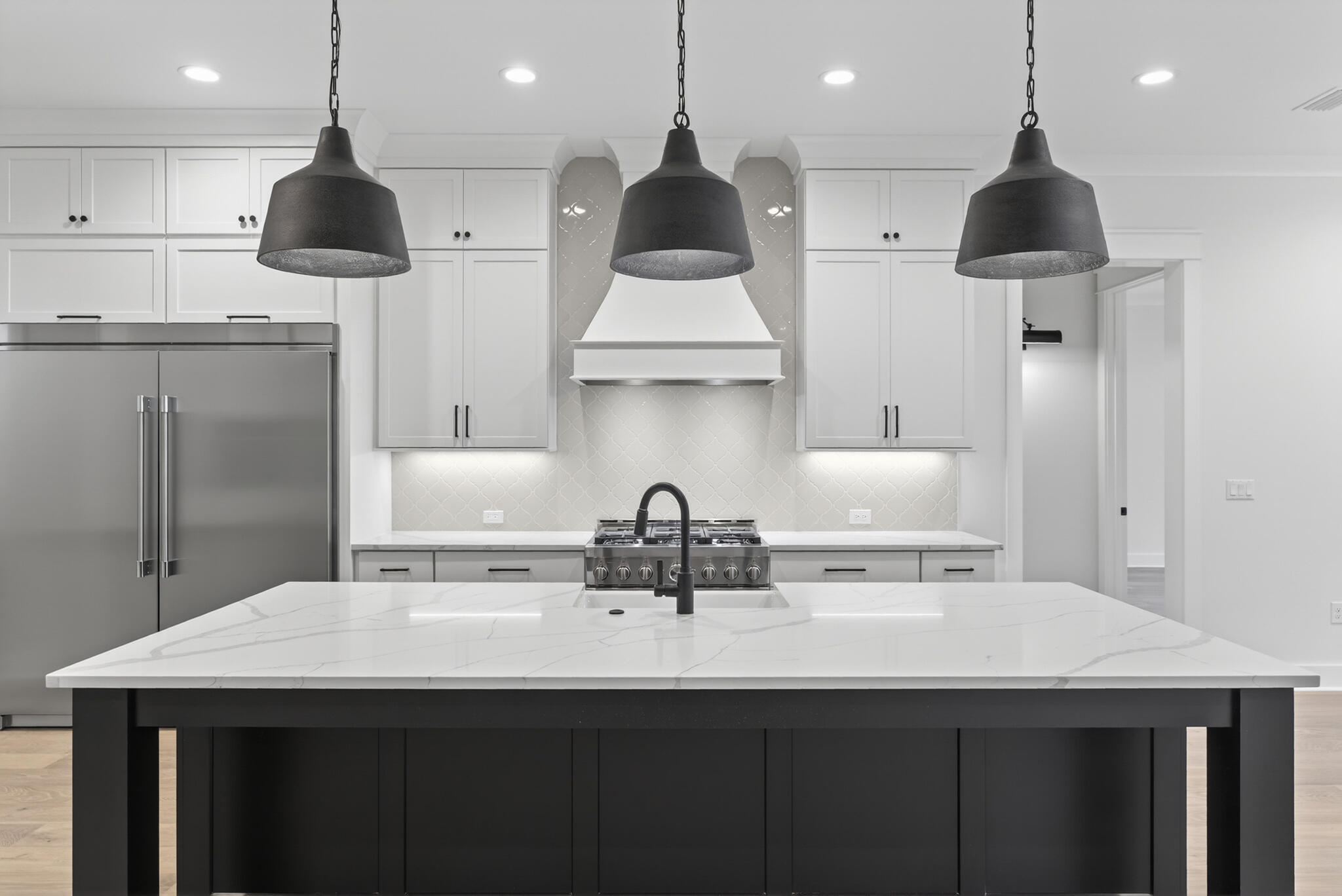 453 Shimmer Circle Freeport, FL 32439 - Photo 11 of 38 a kitchen with a sink a refrigerator and chairs