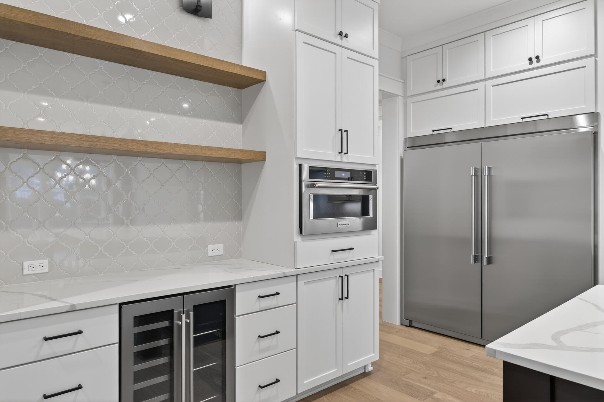 453 Shimmer Circle Freeport, FL 32439 - Photo 13 of 38 a kitchen with kitchen island a counter top space cabinets and stainless steel appliances