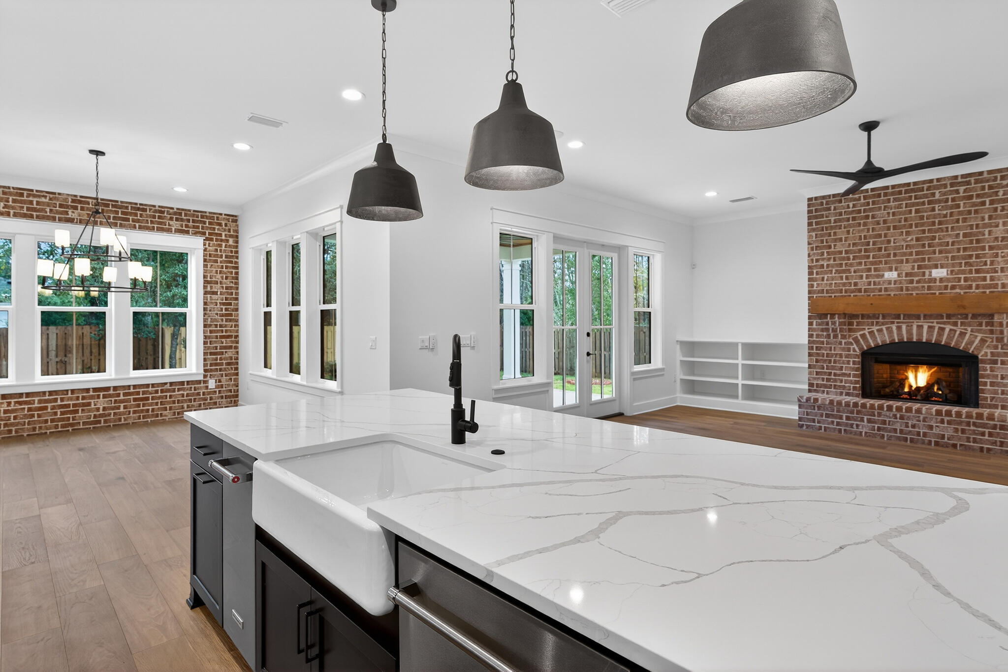 453 Shimmer Circle Freeport, FL 32439 - Photo 17 of 38 a room with wooden floor and chandelier