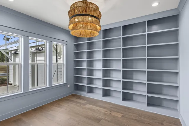 a view of a room with shelves and wooden shelves