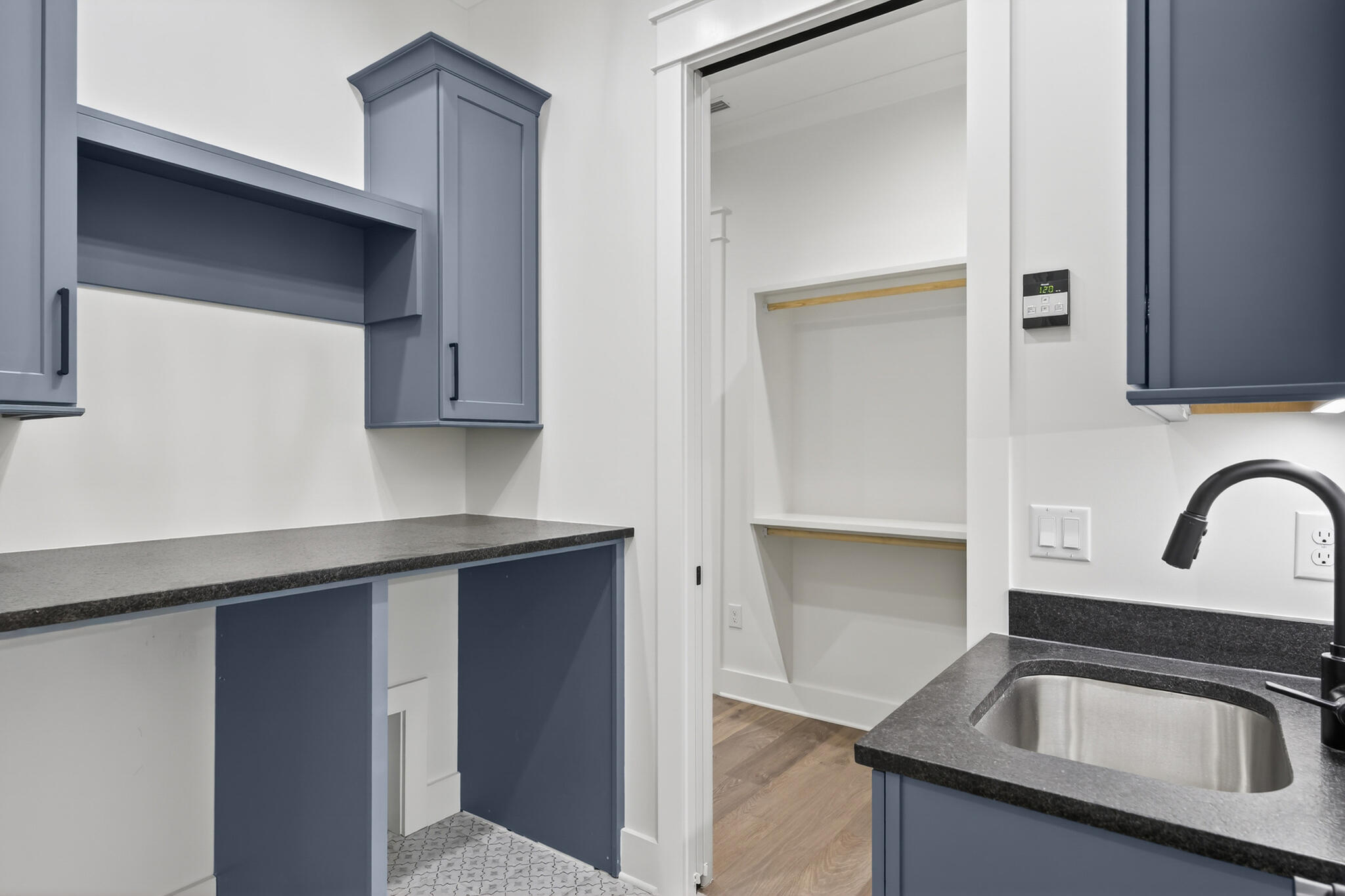 453 Shimmer Circle Freeport, FL 32439 - Photo 28 of 38 a kitchen with granite countertop a sink and cabinets