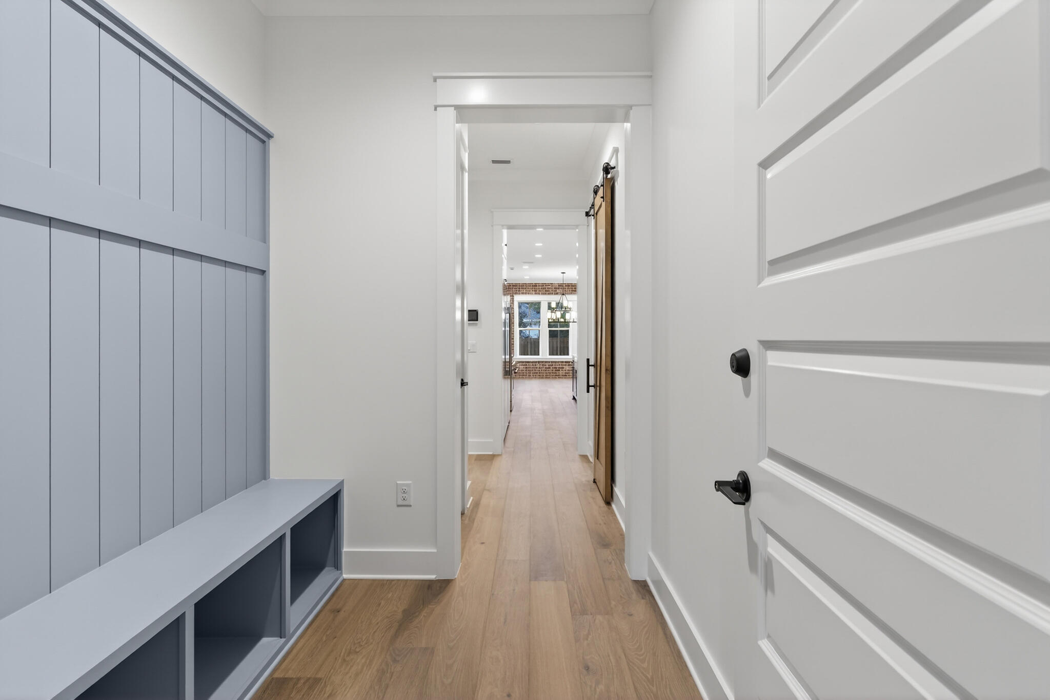 453 Shimmer Circle Freeport, FL 32439 - Photo 34 of 38 a view of a hallway with wooden floor and staircase