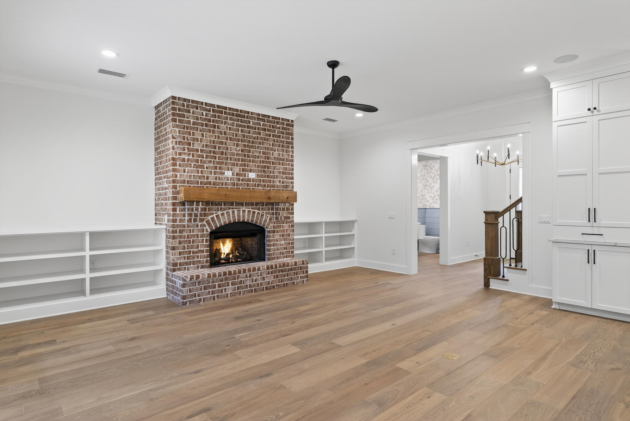 453 Shimmer Circle Freeport, FL 32439 - Photo 7 of 38 a view of a livingroom with a fireplace a ceiling fan and window