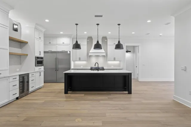 a bathroom with a double vanity sink a mirror and shower