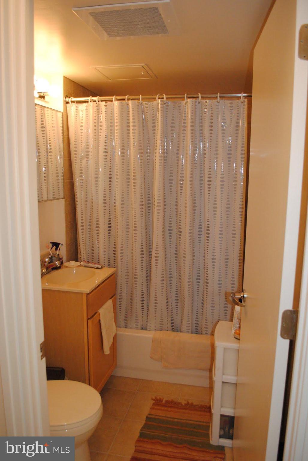 800 4th Street Southwest, Unit S621 Washington, DC 20024 - Photo 13 of 15 a bathroom with a sink a toilet and tub