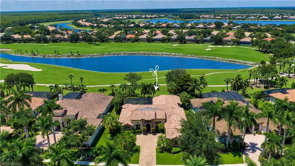 11875 Hedgestone Court Naples, FL 34120 - Photo 28 of 29 Mediterranean-style residence with a tiled roof, expansive golf course frontage, and a private driveway