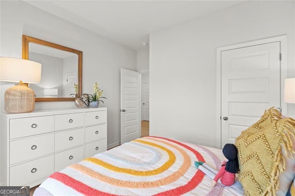 105 Roy Drive Calhoun, GA 30701 - Photo 19 of 28 a bedroom with a bed and a dresser